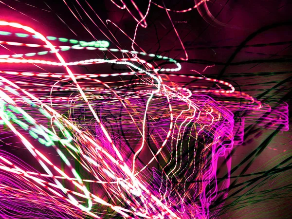 Light painting. Neon glow. Abstract blurred background. Colorful pattern.