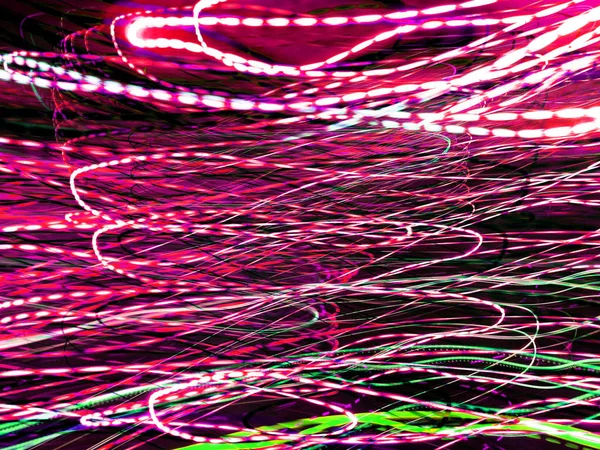 Light painting. Neon glow. Abstract blurred background. Colorful pattern.