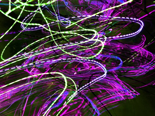 Light painting. Neon glow. Abstract blurred background. Colorful pattern.