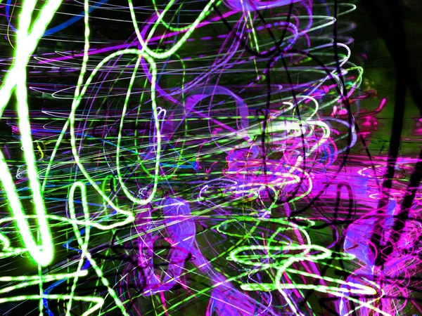 Light painting. Neon glow. Abstract blurred background. Colorful pattern.