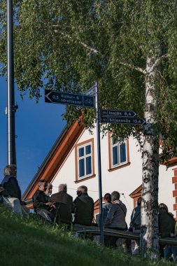 Leksand, Sweden People standing and watching the Swedish midsummer celebration, the largest such celebration in Sweden.