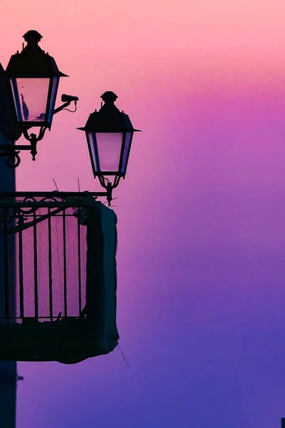 Syracuse, Sicily, Italy Lamp posts on Ortygia island at dawn.