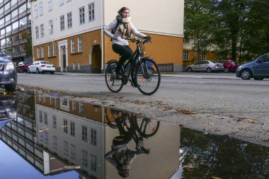 Turku, Finland A bicylist reflected in a puddle