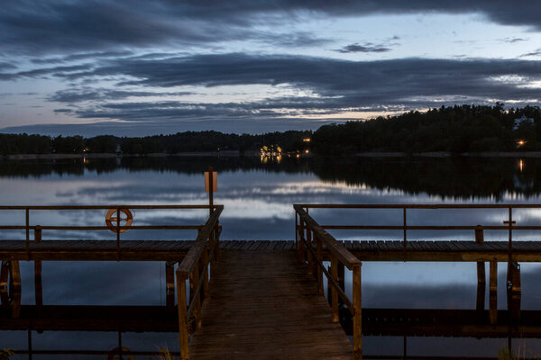 Stockholm, Sweden A midsummer midnight sun view over lake Malaren and a dock.