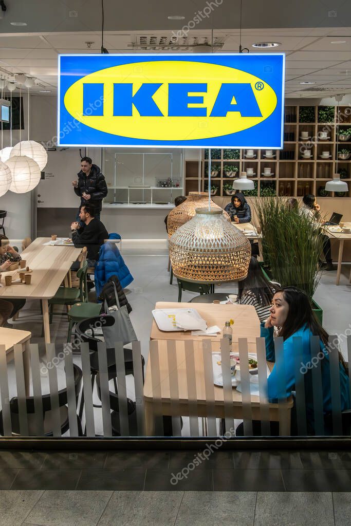 Stockholm, Sweden March 2, 2024 A woman sits at an Ikea restaurant i the Gallerian shopping mall in  downtown.