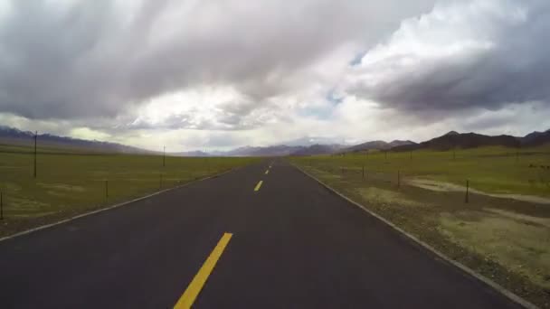 Driving a bus on a country road,Qinghai,China. — Stock Video