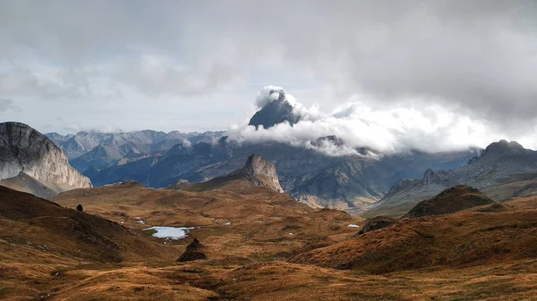 Awesome landscape with hig mountains, clouds and lakes.