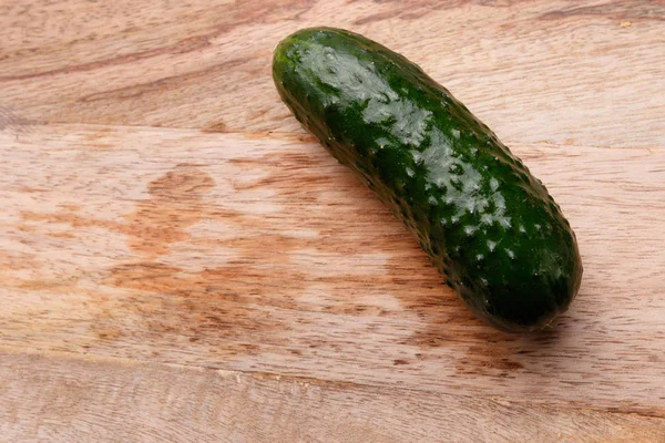 Cucumber on the kitchen board — Stock Photo, Image