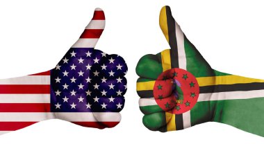 Ulusların ilişkilerini güçlendirme kavramı. İki el farklı ülkelerin bayraklarıyla boyanır ve başparmak kaldırılır. Dominica ve ABD