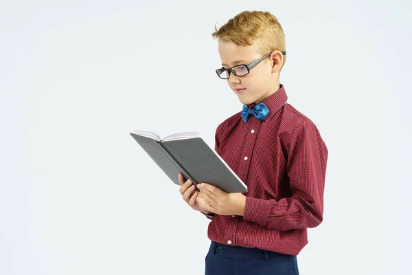 Schoolboy Glasses Reads Book Holds His Hands Isolated Background Education — Stock Photo, Image