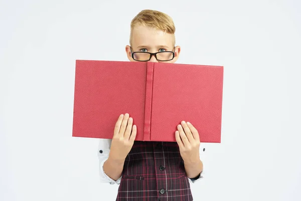 Schoolboy Glasses Hides His Face Books Isolated Background Education Concept — Stock Photo, Image