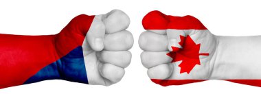 İnsanların mücadelesi kavramı. İki el birbirine kenetlenir ve birbirlerinin karşısındadır. Ülkelerin bayraklarının renklerine boyanmış eller. Kanada Çek Cumhuriyeti 'ne Karşı