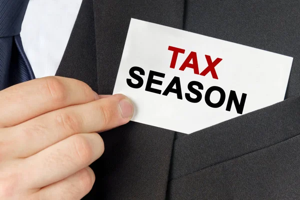 Business Concept Businessman Holds Card Text Tax Season — Stock Photo, Image