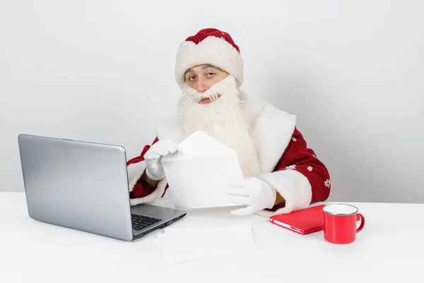 Christmas New Year Concept Santa Claus Sitting His Desk Reading — Stock Photo, Image