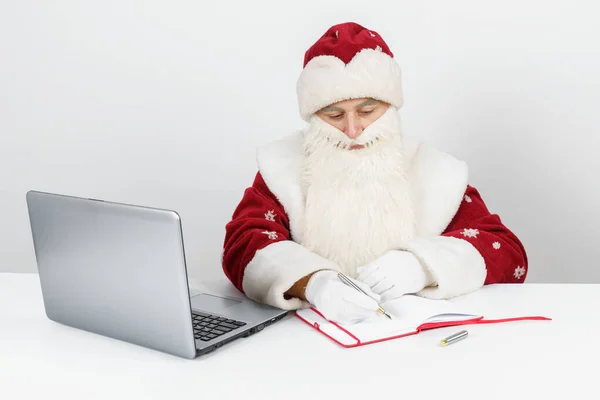 Christmas New Year Concept Santa Claus Sits His Desk Writes — Stock Photo, Image