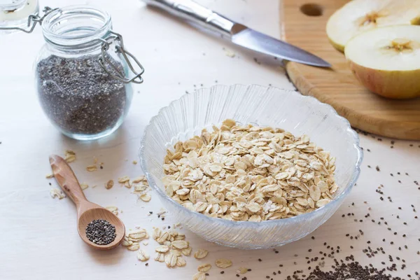 Ingredients Healthy Breakfast Chia Seeds Oatmeal Cereals Apple White Table — Stock Photo, Image