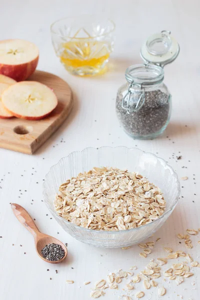 Ingredients Healthy Breakfast Chia Seeds Oatmeal Cereals Apple White Table — Stock Photo, Image