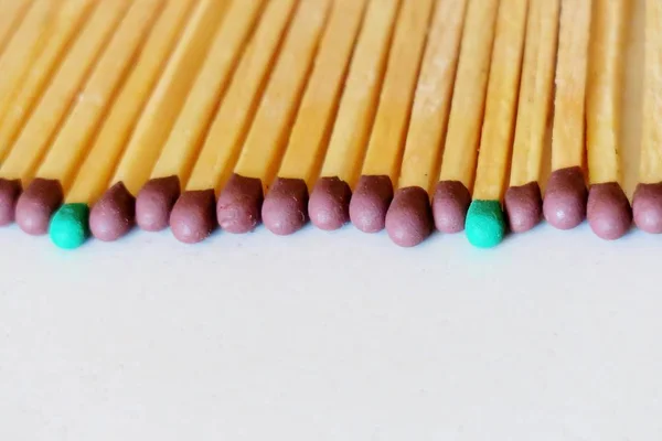 matches of different colors on a white background