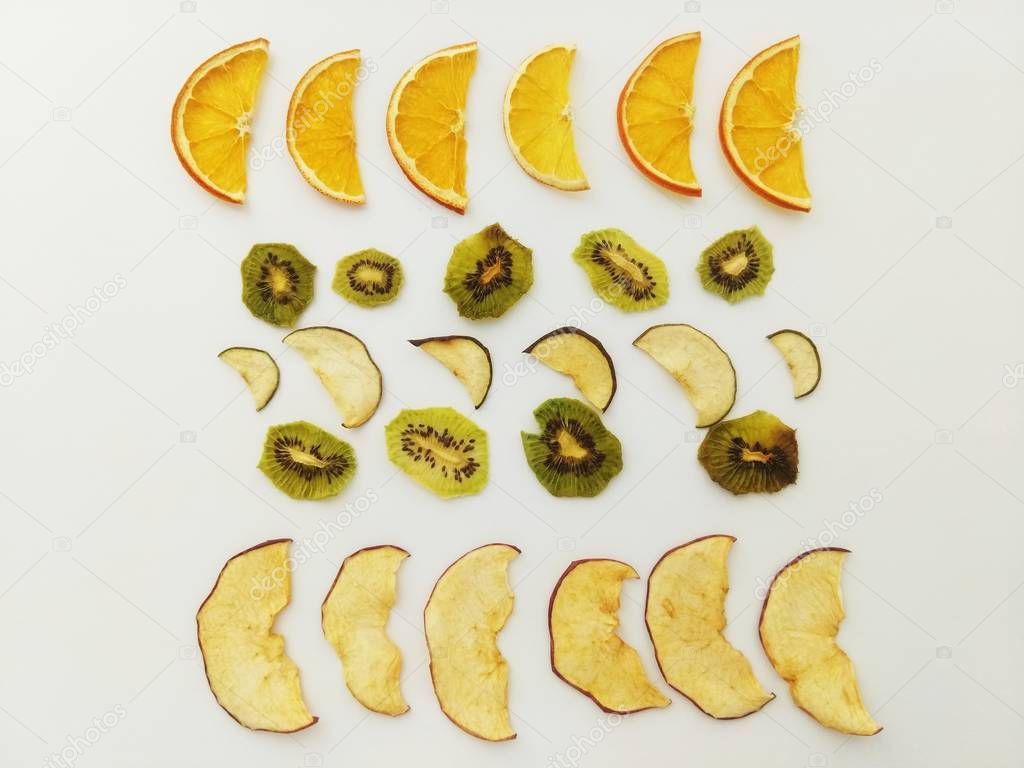 Dried fruits in assortment. Apple, pear, kiwi, orange, natural vitamins. Kids love fruit. The dryer for fruits and vegetables will keep vitamins in fruits.