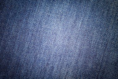 Kot pantolon arka planı. Klasik kot dokusu. Moda giyim yüzeyi.