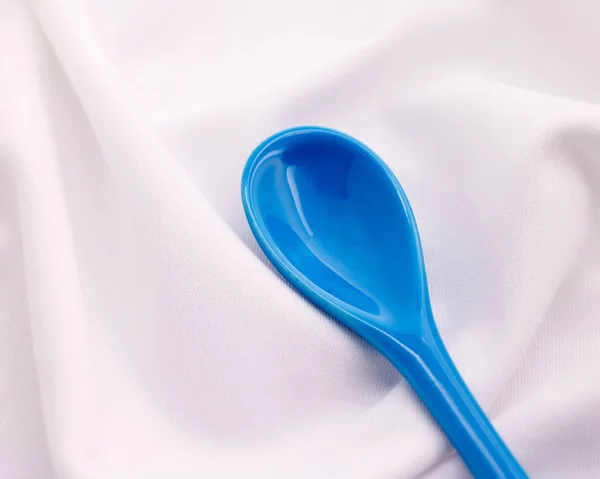 Blue Ceramics Spoon White Fabric Background Colorful Concept — Stock Photo, Image