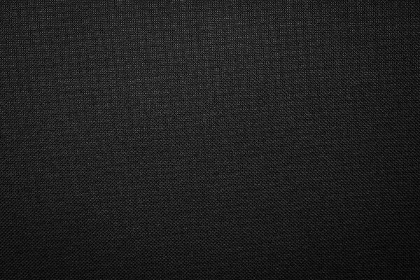 Black fabric texture background. Dark clothing material.