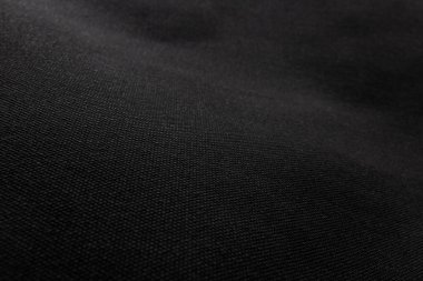 Siyah kumaş dokusu arka planda. Tuval tekstil malzemesinin ayrıntıları.