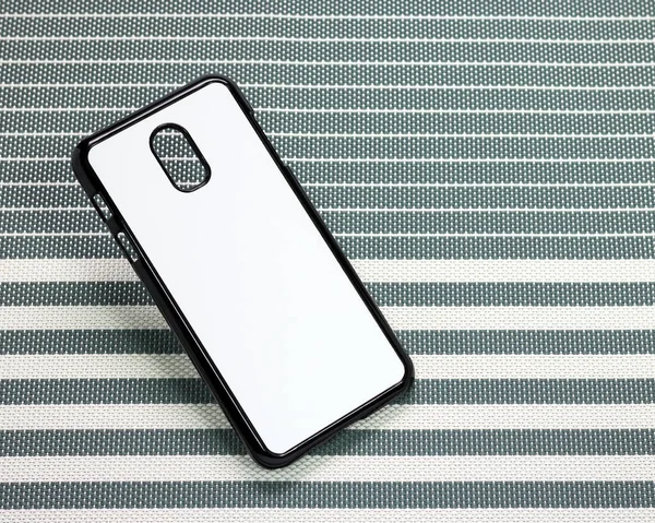 Mobile phone case on stripes background. Back view of phone case surface for your design.
