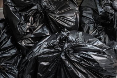 A pile of garbage bags. Trash bags background. clipart