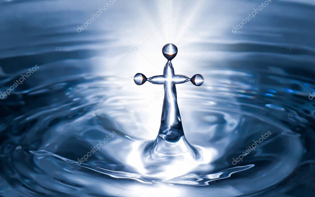 Christian holy water with crucifix cross background. Purity water for ritual.
