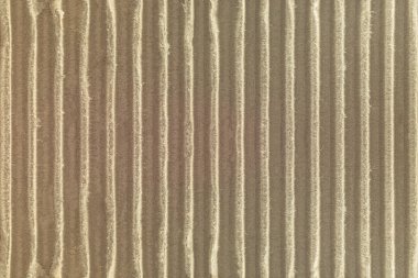 Oluklu mukavva doku arka plan. Doğal malzemeden yapılmış zanaat kağıt detay.