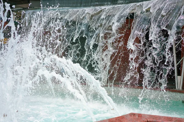 The gush of water of a fountain. Splash of water in the fountain, abstract image