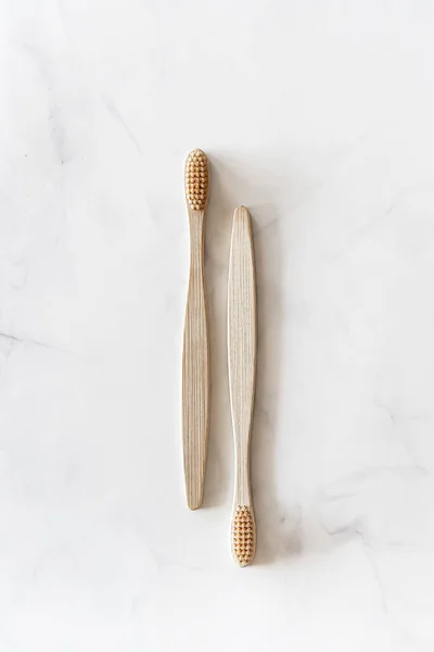 Eco friendly bamboo toothbrushes on marble background. — Stock Photo, Image
