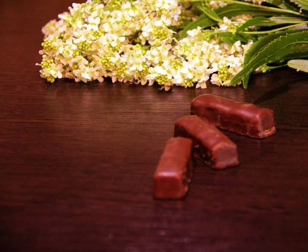 still life: chocolates and flowers