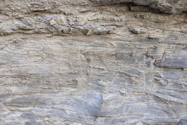 Kaya yüzeyinin doğal dokusu, zamanın uzun kayasında çizilen çizgileri görebilirsiniz. Arka plan olarak kullanılabilir.