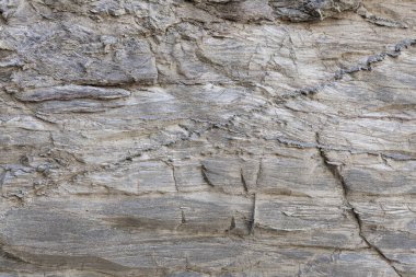 Kaya yüzeyinin doğal dokusu, zamanın uzun kayasında çizilen çizgileri görebilirsiniz. Arka plan olarak kullanılabilir.