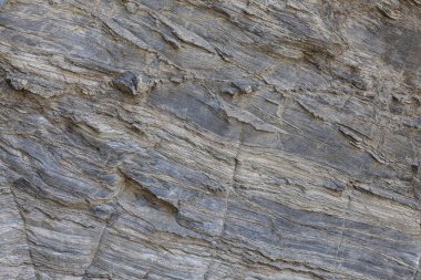 Doğal taş dokusu. Kaya yüzeyinin doğal dokusu, uzun süre çizilen çizgileri görebilirsiniz. Arka plan olarak kullanılabilir.