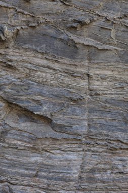 Doğal taş dokusu. Kaya yüzeyinin doğal dokusu, uzun süre çizilen çizgileri görebilirsiniz. Arka plan olarak kullanılabilir.