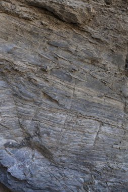 Doğal taş dokusu. Kaya yüzeyinin doğal dokusu, uzun süre çizilen çizgileri görebilirsiniz. Arka plan olarak kullanılabilir.