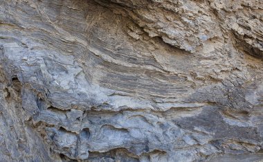 Deniz dalgalarının güçleri tarafından oyulmuş kaya. Arka plan olarak kullanılabilir.
