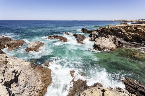 Transparent cove protected from sea waves by cliffs in Alentejo in Portugal.