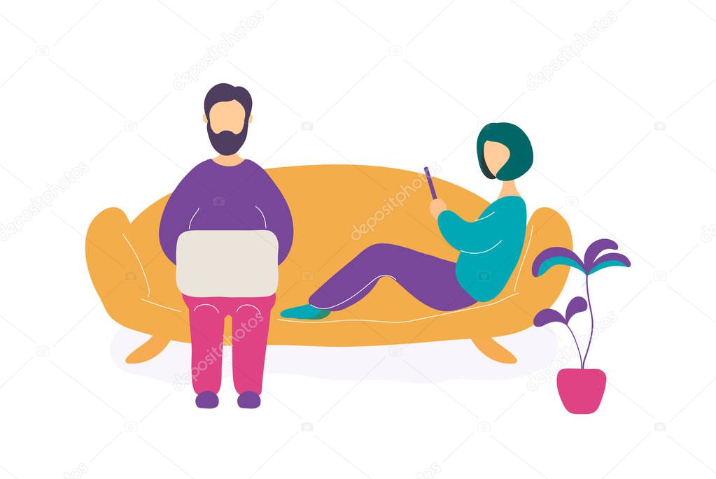 Couple sitting on sofa with laptop and smartphone