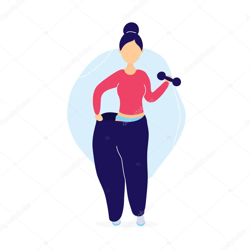 Woman in oversized pants with dumbbells