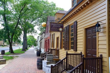 Williamsburg, Virginia, U.S.A - June 30, 2020 - The view of the street with beautiful colonial homes and stores clipart