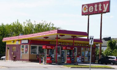 Newark, Delaware, U.S.A - Sept 14, 2025 - The Getty gas station with red-yellow branding; multiple self-serve pumps and mini mart, located at busy street corner