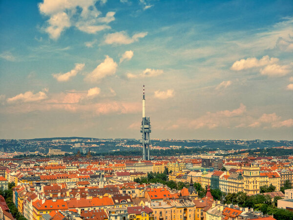 Aerial view of TV tower in Prague Zizkov under hot summer and clouds
