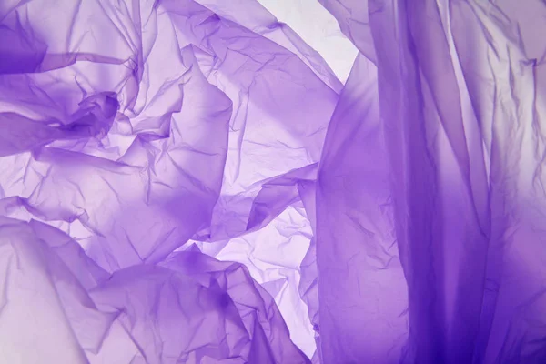 Plastic bag background. Designed grunge purple texture, background. Abstract tones copy space template. Violet texture.