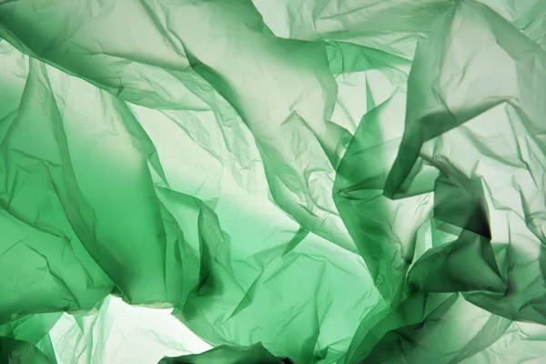 Plastik torba konsepti. Polietilen arka plan olarak kullanabilirsiniz. Açık renkler. Kart, poster, afiş tasarımı için şablon. Renkli doku.