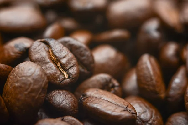 Mixture of different kinds of coffee beans. Coffee Background. Brown coffee, background texture, close-up.