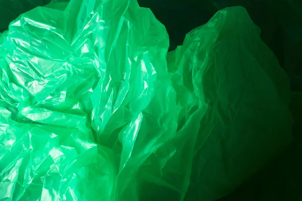 Yeşil plastik torba doku ve arka plan. Yeşil renkte plastik torba dokusu. Tasarım için soyut arka plan ve doku.